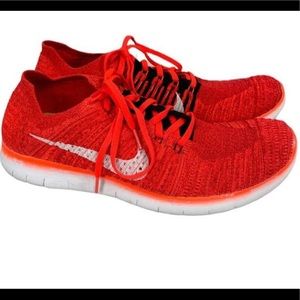 Nike Flyknit Orange Sneakers. Mens 8.5, Women’s 10.  Unisex